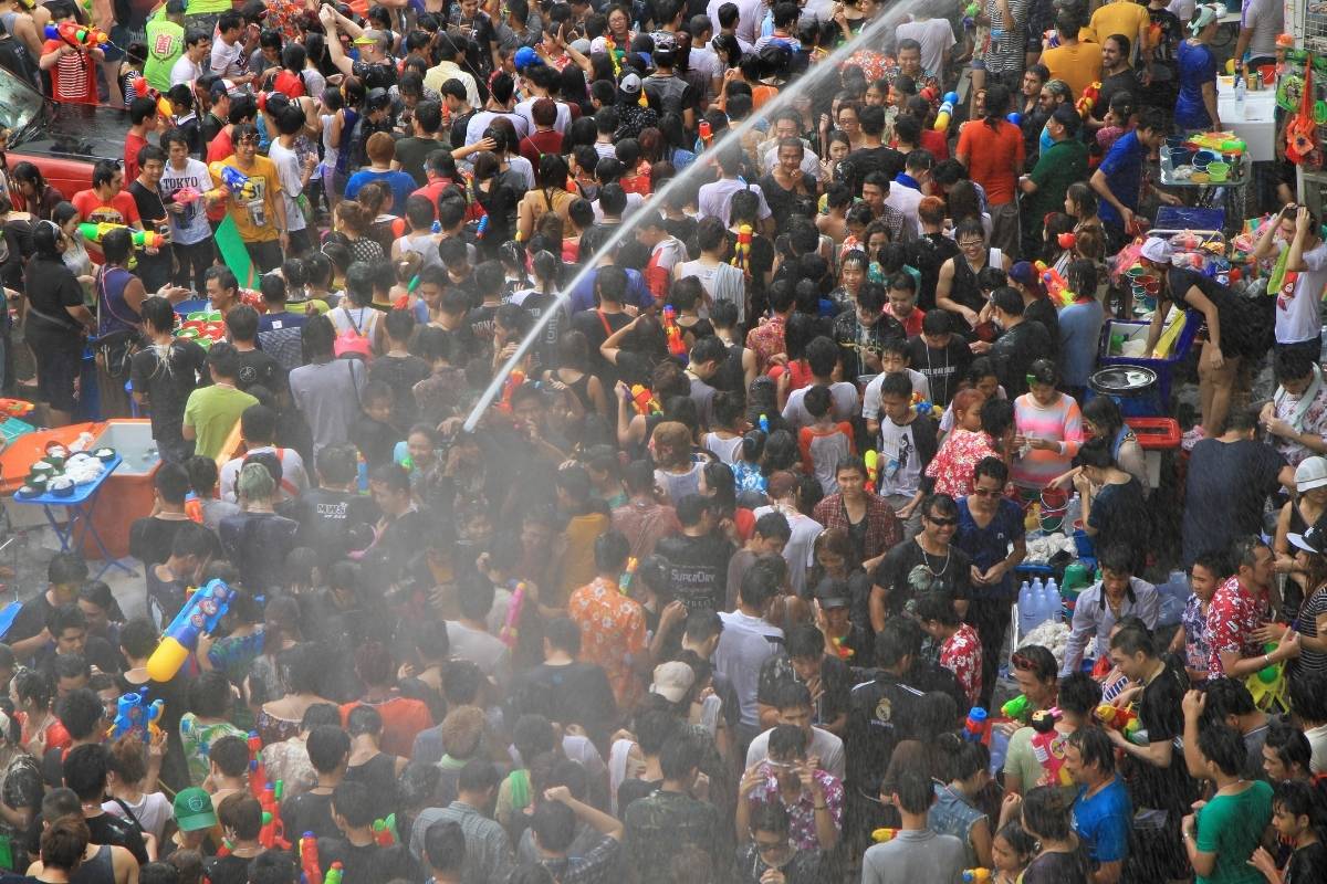 people celebrating songkran phuket festival in kata beach